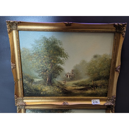 21A - 2x gilt framed oil paintings country landscapes Les Parson 47cm x 37cm