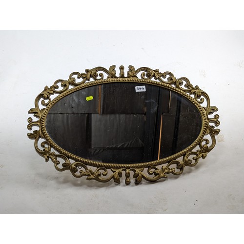 54A - Ornate oval framed mirror