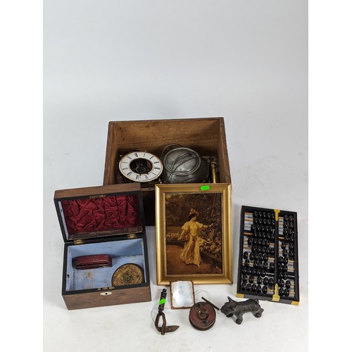 498A - Wooden box of collectable items inc Lotus flower Abacus, brass skeleton clock, wooden fishing reel, ... 