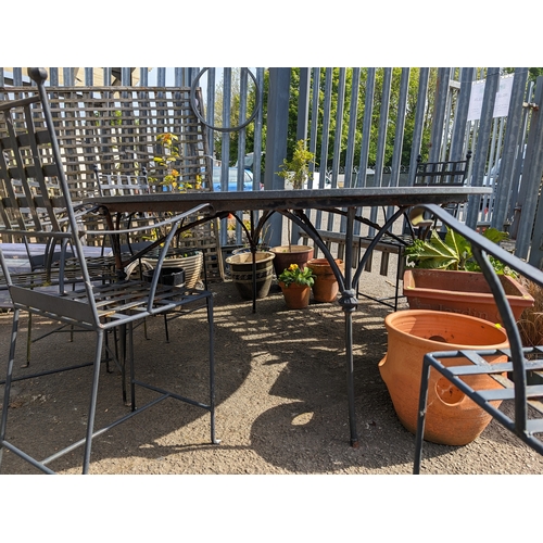 168 - Impressive granite topped circular garden table with metal base. D176cm H80cm