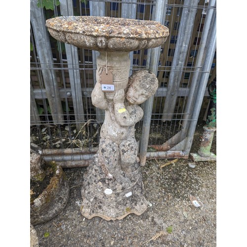 24 - Concrete cherub supporting bird bath ht. 75cm