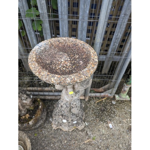 24 - Concrete cherub supporting bird bath ht. 75cm