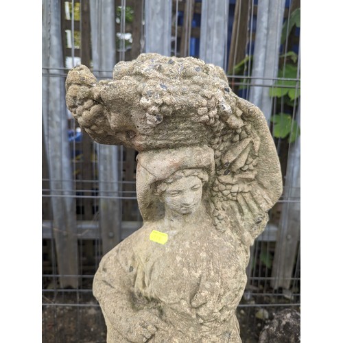 26 - Concrete statue of a lady with harvest, ht. 79cm approx.