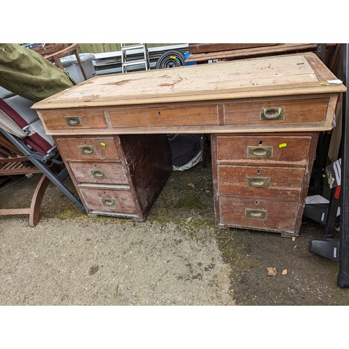 229 - Seven drawer pedestal desk with broad arrow 1915 marked to lock plates (AF) 126cm x 59cm x H71cm