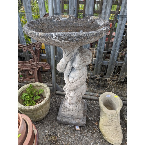 30 - Concrete cherub bird bath with some areas of loss to the bath D41cm x H81cm