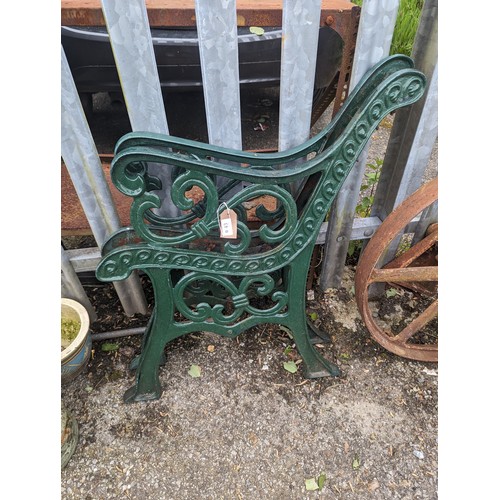 43 - Pair of green cast iron garden bench ends