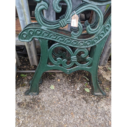 43 - Pair of green cast iron garden bench ends