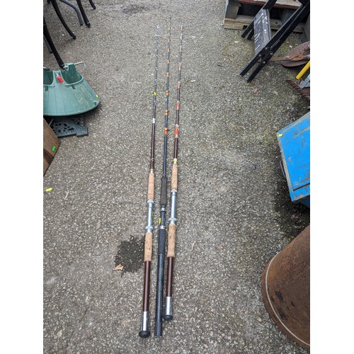 110 - Three sea fishing rods