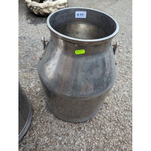 89 - Two stainless steel milk churns, one marked 'Fulwood', ht. 41cm