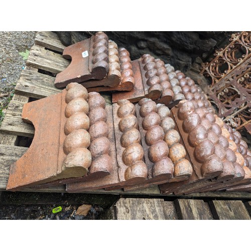 88 - Twenty three Victorian terracotta rope edging tiles 24 x 18cm