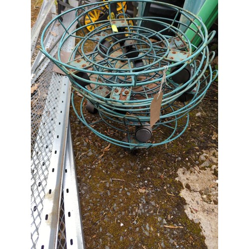 122 - Six wheeled wire plant stands