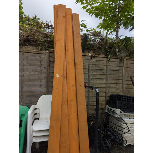 123 - Twelve treated softwood boards, length approx. 300cm