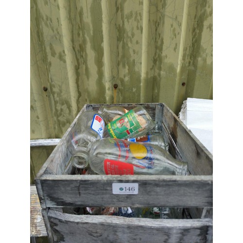 146 - Crate containing vintage milk bottles