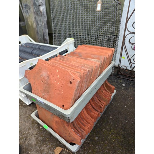 156 - Two trays of clay fish tail roof tiles