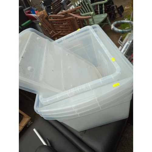 178 - Four large plastic storage boxes with three lids