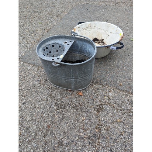 60 - Galvanized mop bucket and enamelled twin handled pot