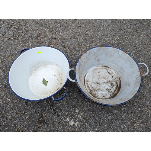 58 - Two enamel handled pans, largest dia. 48cm