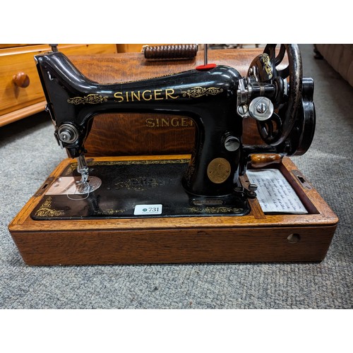 731 - Singer manual sewing machine in case