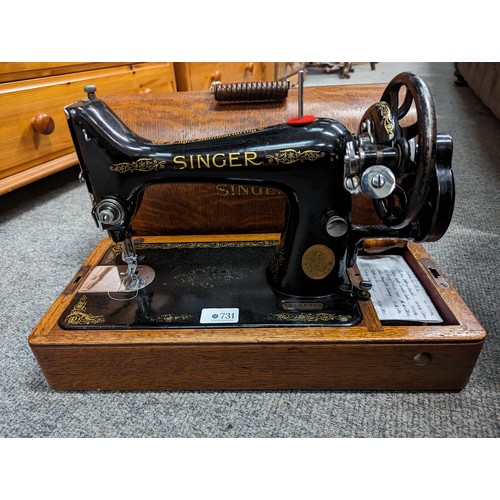 731 - Singer manual sewing machine in case