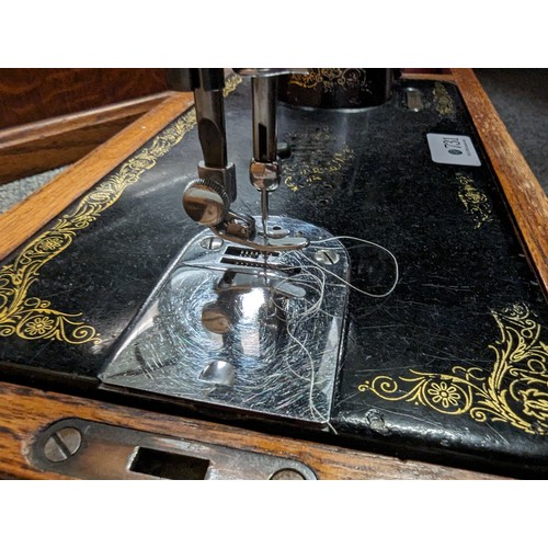 731 - Singer manual sewing machine in case