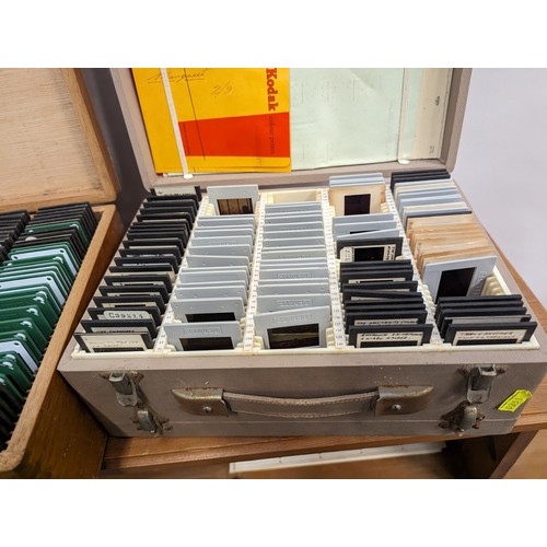 724 - two cases of vintage slides. Mixed including landmarks.