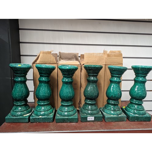 745 - 6 x green glazed ceramic candle holders Approx H32cm  