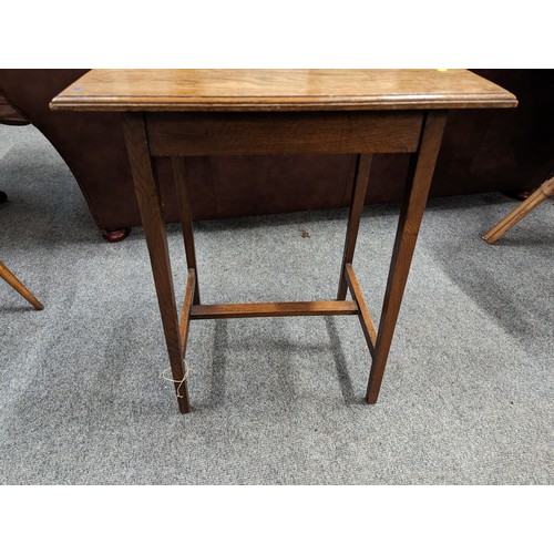 707 - Arts and Crafts style oak occasional table. Diameter. 56cm x 41cm x 68cm.