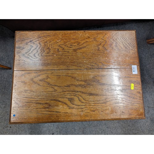 707 - Arts and Crafts style oak occasional table. Diameter. 56cm x 41cm x 68cm.