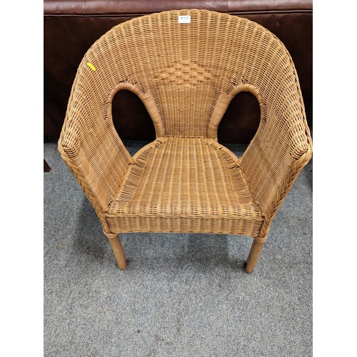 708 - Wicker tub chair. Height at back. 73cm