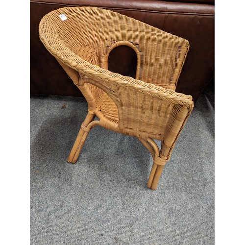 708 - Wicker tub chair. Height at back. 73cm