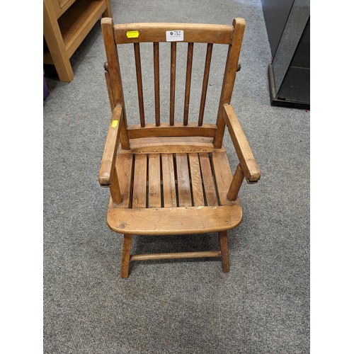 712 - Vintage childs chair with flip over table.