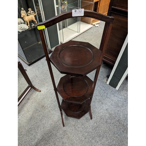 713 - Mahogany foldable 3 tier cake stand with a table top swing mirror. 