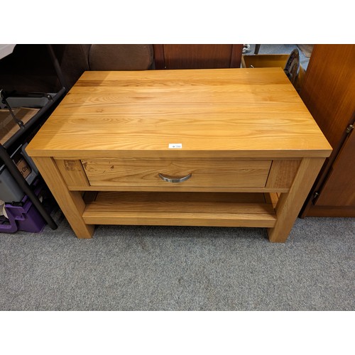 716 - Coffee table with lower drawer and shelf. W 88cm x D 56cm x H49cm.