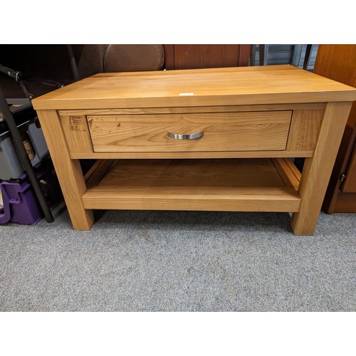 716 - Coffee table with lower drawer and shelf. W 88cm x D 56cm x H49cm.