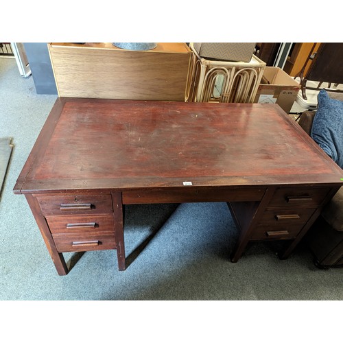 718 - M.O.D style seven drawer desk. W 152cm x D 83cm x H 78cm