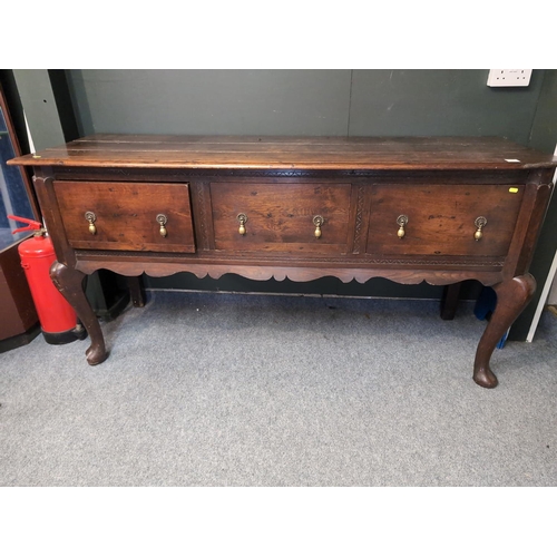 33 - An early c19 oak dresser base/sideboard. W182cm D60cm H90cm