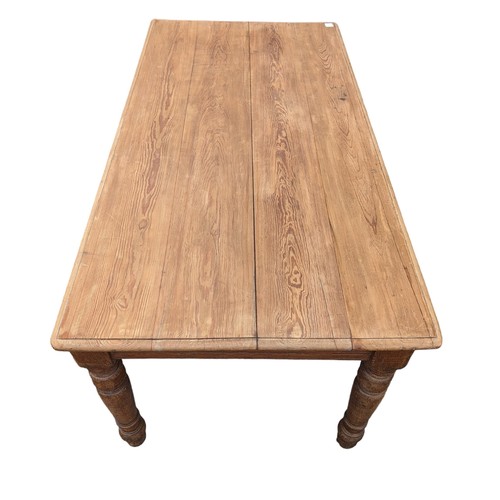 101 - Late Victorian pitch pine 4 plank table. Raised on turned supports. Salvaged from Crownhill Fort, Pl... 