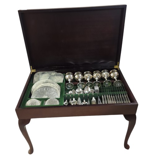 102 - Leather topped canteen table containing Butler of Sheffield silver plated six serving cutlery, goble... 