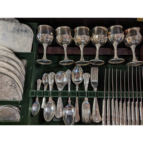 102 - Leather topped canteen table containing Butler of Sheffield silver plated six serving cutlery, goble... 