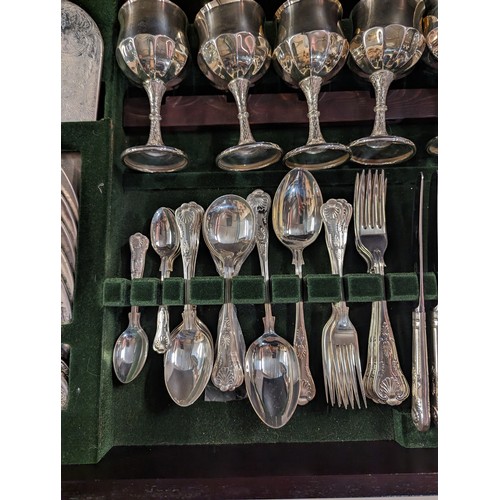 102 - Leather topped canteen table containing Butler of Sheffield silver plated six serving cutlery, goble... 