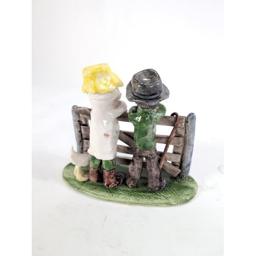 150 - Alan Young pottery figural group: farmers and a goose at a gate, signed to base, L22 x H18cm