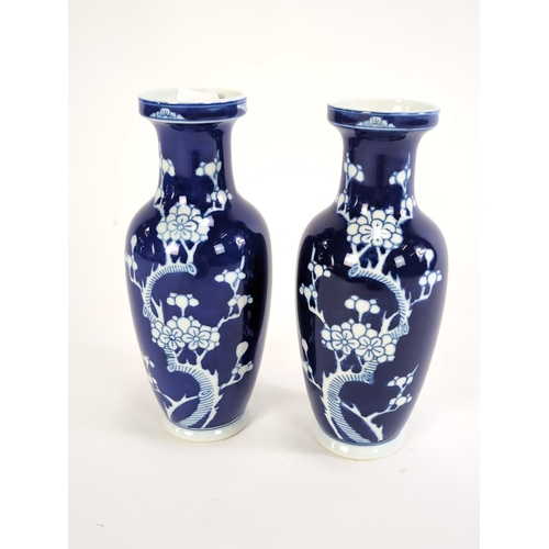 155 - Pair of C20th Chinese cobalt blue and white vases decorated with prunus blossom, height 26cmm, blue ... 