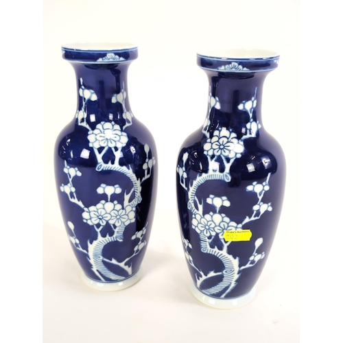 155 - Pair of C20th Chinese cobalt blue and white vases decorated with prunus blossom, height 26cmm, blue ... 