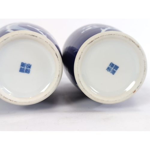 155 - Pair of C20th Chinese cobalt blue and white vases decorated with prunus blossom, height 26cmm, blue ... 