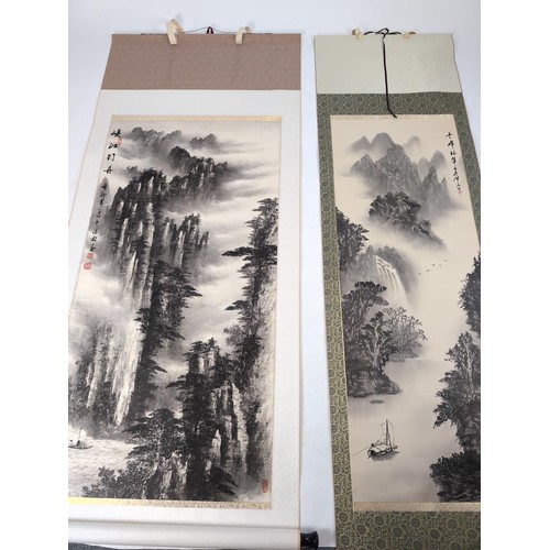 168 - 2 Chinese scrolls, a landscape on silk, 67 x 207 cms, with blue & white ceramic weighted end plu... 