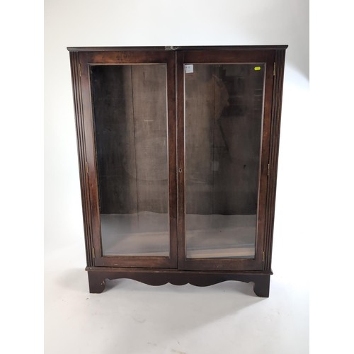 49 - Glazed glass fronted  bookcase with 3 adjustable shelves.103cm by 27cm by 133cm