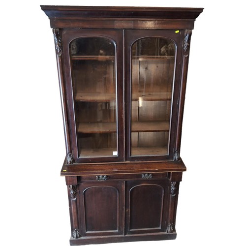 51 - Bookcase with two upper glazed doors 106cm by 40cm by 212cm approx