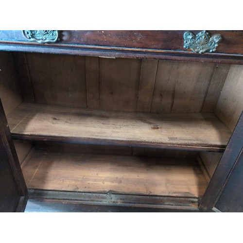 51 - Bookcase with two upper glazed doors 106cm by 40cm by 212cm approx