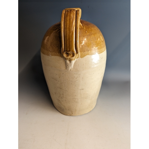 202 - Stoneware flagon marked 