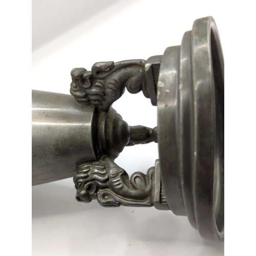 225 - Pewter trumpet shaped vase supported by three lions, height 28cm